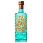 En flaske med Silent Pool Gin, grønn med lekkert gulldesign.